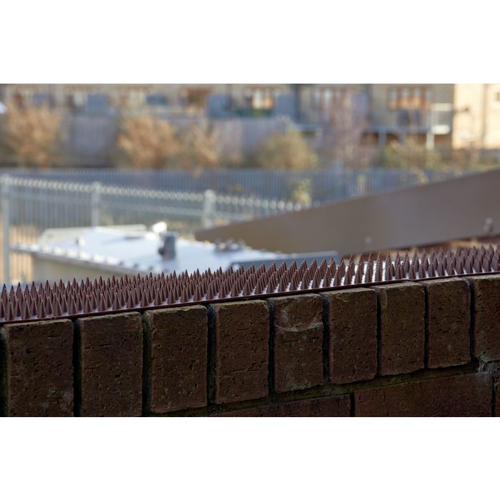 Anti-climb security spike strips